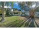 Inviting single-story home with a well-kept lawn, and a cozy front porch at 7556 Sw 112Th Ln, Ocala, FL 34476