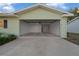 Open garage showcasing the spacious interior and exterior of the home at 7556 Sw 112Th Ln, Ocala, FL 34476