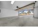 Spacious garage with a large overhead door and ample room for vehicles and storage at 7556 Sw 112Th Ln, Ocala, FL 34476