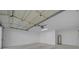 A clean and spacious garage featuring a water heater at 7556 Sw 112Th Ln, Ocala, FL 34476