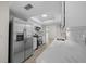 Updated kitchen featuring stainless steel appliances, quartz countertops, and bright natural light at 7556 Sw 112Th Ln, Ocala, FL 34476
