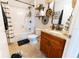 Bathroom with granite vanity and black and white decor at 7958 Juniper Rd, Ocala, FL 34480