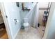 Well-appointed bathroom with toilet, shower, and tiled floors at 7958 Juniper Rd, Ocala, FL 34480