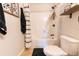 Clean bathroom with shower/tub combo and black and white decor at 7958 Juniper Rd, Ocala, FL 34480