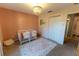 Well-lit Bedroom with two cribs, closet, and decorative wall at 7958 Juniper Rd, Ocala, FL 34480