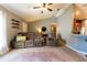 Relaxing living room with brown sectional and large area rug at 7958 Juniper Rd, Ocala, FL 34480