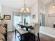 Bright dining room with a rustic table and neutral decor at 8476 Sw 108Th Place Rd, Ocala, FL 34481