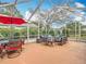 Relaxing screened patio with seating and dining areas at 8476 Sw 108Th Place Rd, Ocala, FL 34481