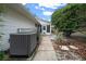 AC unit and pathway leading to the backyard at 8597 Sw 108Th Lane Rd, Ocala, FL 34481