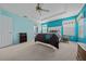 Serene bedroom featuring teal walls, plush carpet and a ceiling fan at 8597 Sw 108Th Lane Rd, Ocala, FL 34481