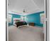 Relaxing bedroom with teal walls, plush carpet and ceiling fan at 8597 Sw 108Th Lane Rd, Ocala, FL 34481