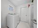 Laundry room with washer, dryer, and access to the outside at 8597 Sw 108Th Lane Rd, Ocala, FL 34481