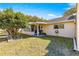 Backyard view showing patio, grass, and landscaping at 8677 Sw 95Th Ln # F, Ocala, FL 34481