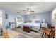 Serene main bedroom with a king-size bed and light blue walls at 8677 Sw 95Th Ln # F, Ocala, FL 34481