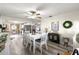 Spacious dining area with a white table and chairs, perfect for gatherings at 8677 Sw 95Th Ln # F, Ocala, FL 34481