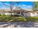 Inviting home exterior with a charming porch and well-manicured lawn at 8677 Sw 95Th Ln # F, Ocala, FL 34481