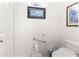 Small half bathroom with toilet and elevated toilet seat at 8796 Sw 83Rd Cir, Ocala, FL 34481