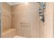 Walk-in shower with tiled walls and built-in seat at 8796 Sw 83Rd Cir, Ocala, FL 34481