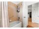 Bathroom with tub, shower, and tiled walls at 8796 Sw 83Rd Cir, Ocala, FL 34481