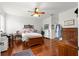 Spacious bedroom with hardwood floors and antique furniture at 8796 Sw 83Rd Cir, Ocala, FL 34481