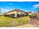 Tan house exterior with well-manicured lawn at 8796 Sw 83Rd Cir, Ocala, FL 34481