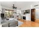 Living room with hardwood floors, fireplace, and access to patio at 8796 Sw 83Rd Cir, Ocala, FL 34481