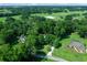 Aerial view showing home nestled in a lush, wooded landscape at 8930 Sw 8Th St, Ocala, FL 34481