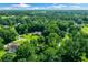 Aerial view showcasing home's private setting with surrounding greenery at 8930 Sw 8Th St, Ocala, FL 34481