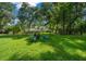 Spacious backyard with fire pit and playset at 8930 Sw 8Th St, Ocala, FL 34481