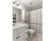 Simple bathroom with a shower/tub combo and white vanity at 8930 Sw 8Th St, Ocala, FL 34481