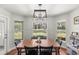 Bright dining room with wood table and chairs, overlooking the backyard at 8930 Sw 8Th St, Ocala, FL 34481