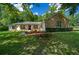 Stone and white exterior with a welcoming front porch at 8930 Sw 8Th St, Ocala, FL 34481