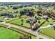 Aerial view showing a house on a spacious lot with surrounding green fields at 9270 Sw 9Th Ter, Ocala, FL 34476