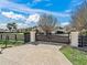 Long driveway leading to a home with a gated entrance at 9270 Sw 9Th Ter, Ocala, FL 34476