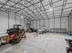 Interior view of a large garage, ideal for storing vehicles and equipment at 9270 Sw 9Th Ter, Ocala, FL 34476