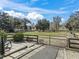 Open grassy paddock with wooden fencing at 9270 Sw 9Th Ter, Ocala, FL 34476