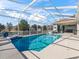 Refreshing screened pool with open patio at 9270 Sw 9Th Ter, Ocala, FL 34476