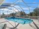 Enclosed pool with a screened-in enclosure at 9270 Sw 9Th Ter, Ocala, FL 34476