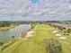 Aerial view of golf course with lake and residential area at 9326 Sw 52Nd Loop, Ocala, FL 34481