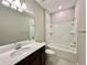 Bathroom with tub, vanity, and toilet at 9326 Sw 52Nd Loop, Ocala, FL 34481