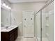 Bathroom with vanity, shower, and glass enclosure at 9326 Sw 52Nd Loop, Ocala, FL 34481