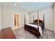 Bedroom with a wooden four-poster bed and en-suite bathroom at 9326 Sw 52Nd Loop, Ocala, FL 34481