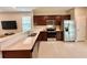 Modern kitchen with stainless steel appliances and light quartz countertops at 9326 Sw 52Nd Loop, Ocala, FL 34481