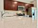 Close up of kitchen island with quartz countertop at 9326 Sw 52Nd Loop, Ocala, FL 34481