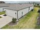 Single-story home's back, showcasing a two-car garage and a partially visible yard at 9326 Sw 52Nd Loop, Ocala, FL 34481