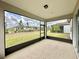 Screened porch with view of backyard and neighboring houses at 9326 Sw 52Nd Loop, Ocala, FL 34481