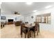 Bright dining area with table and chairs, adjacent to living room at 9662 Sw 95Th Ct # A, Ocala, FL 34481