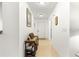 Hallway with tile flooring and wooden console table at 9662 Sw 95Th Ct # A, Ocala, FL 34481