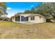 Ranch style home with a screened patio and large backyard at 9662 Sw 95Th Ct # A, Ocala, FL 34481