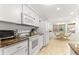 Bright kitchen with granite countertops and white cabinets at 9662 Sw 95Th Ct # A, Ocala, FL 34481